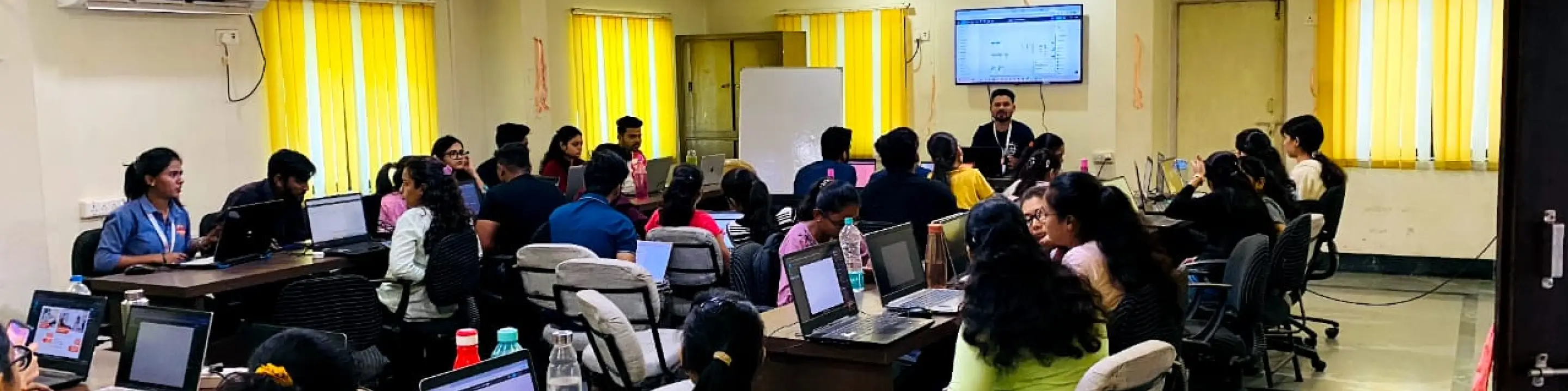 Classroom banner with students and teacher learning together