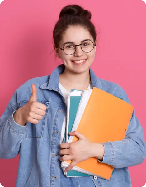 Smiling girl holding books and giving thumbs up